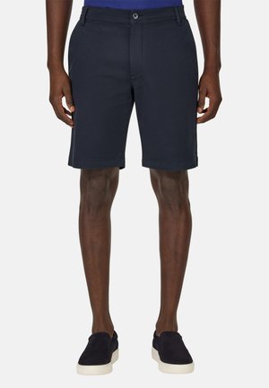 Shorts bleu marine en tissu doux, dotés d'une fermeture à bouton et de passants de ceinture, avec une coupe droite et des ourlets retroussés.