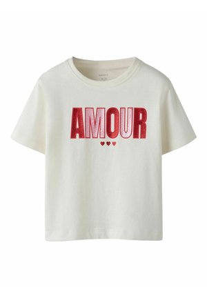 White short-sleeve toddler t-shirt with glittery red "AMOUR" text and three small red hearts below the text on the front.