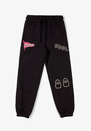 Black sweatpants with elastic waistband. Features pink "grmu" logo, "NABL" in white, and white outline of shoes on the lower leg. Soft material.