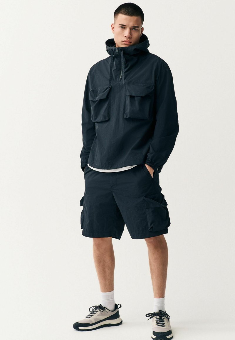 Next - Cortaviento - black, Ampliar