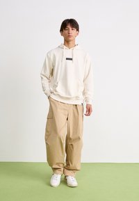 Ellesse VARI - Mikina s kapucňou - oatmeal marl