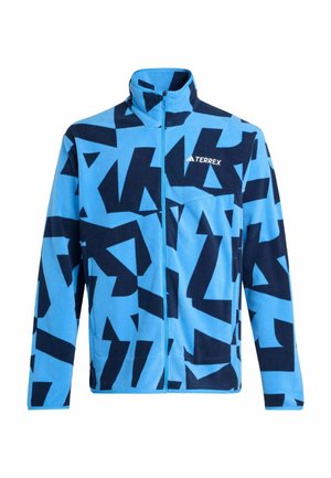 Blauwe fleecjas met grote marineblauwe geometrische patronen, vol zip ontwerp, hoge kraag en "TERREX" logo op de borst.