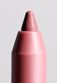 Cranio rosa con punta conica, finitura opaca e texture liscia. La punta è leggermente più scura rispetto al corpo del cranio, evidenziando la variazione di colore.
