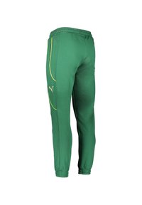 Grüne Jogginghose mit elastischem Bund, schmal zulaufenden Beinen, gelben Akzenten und einem Puma-Logo. Hergestellt aus weichem, leichtem Material.