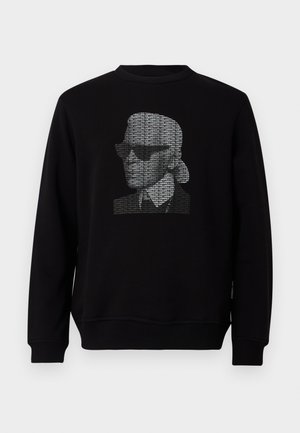 Felpa nera con un ritratto stilizzato composto da testo ripetuto "KARL LAGERFELD" in bianco sul petto.