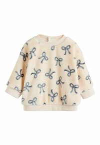 Helles rosa Fleece-Sweatshirt mit marineblauen Schleifenmustern, Rundhalsausschnitt und elastischen Bündchen. Weicher Stoff und leicht oversized Design.