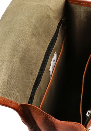 Braune Lederhandtasche mit einem beigen Canvas-Futter. Verfügt über eine Reißverschlusstasche und einen genähten Lederrand. Innenansicht zeigt geräumige Fächer.
