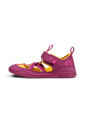 Purple velcro sandal with yellow accents. Features crisscross straps, a soft fabric upper, and a durable rubber sole. Lightweight design.