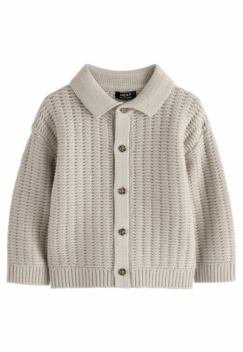 Cardigan en tricot beige avec un col, un motif texturé, une fermeture à boutons sur le devant et des poignets et un ourlet côtelés.