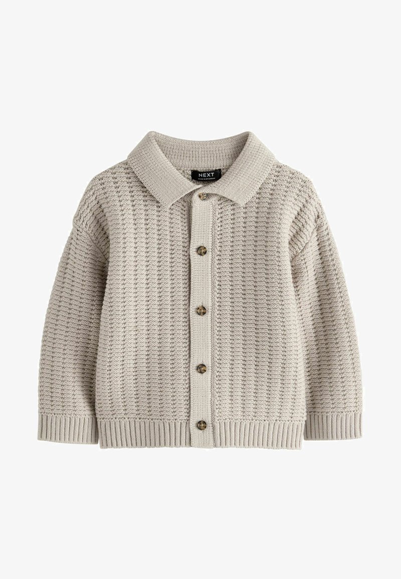 Cardigan en tricot beige avec un col, un motif texturé, une fermeture à boutons sur le devant et des poignets et un ourlet côtelés.