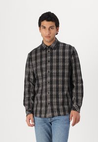Long-sleeve button-up shirt in black and beige check pattern, made from soft fabric with a classic collar and button front.