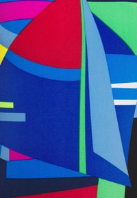 Geometric fabric in vibrant colors: red, blue, green, and yellow. Features bold shapes and lines, creating a dynamic abstract pattern.