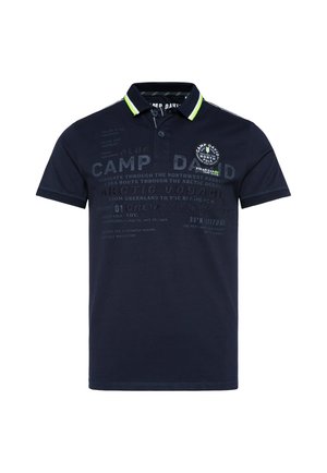Navy blue polo shirt with a two-button placket, short sleeves, and green collar accents. Features prints and a badge on the chest.