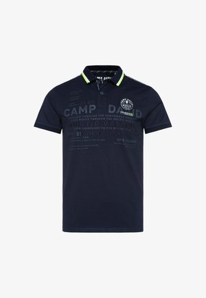 Navy blue polo shirt with a two-button placket, short sleeves, and green collar accents. Features prints and a badge on the chest.