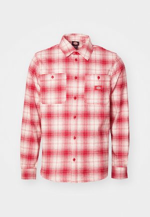 Red and white checkered flannel shirt with long sleeves, button-up front, two chest pockets, and a label on the left. Soft texture.