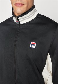 Fila JACKET BJÖRN - Jakna za treniranje - black/white alyssum