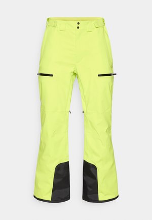 Lysestjerne gule skibukser med sorte accenter, lynlåslommer og justerbar talje, lavet af et slidstærkt, vejrbestandigt materiale.