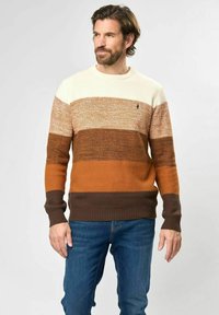 Knitted sweater with horizontal stripes in cream, light brown, orange, and dark brown. Features ribbed cuffs and hem, with a small logo on chest.