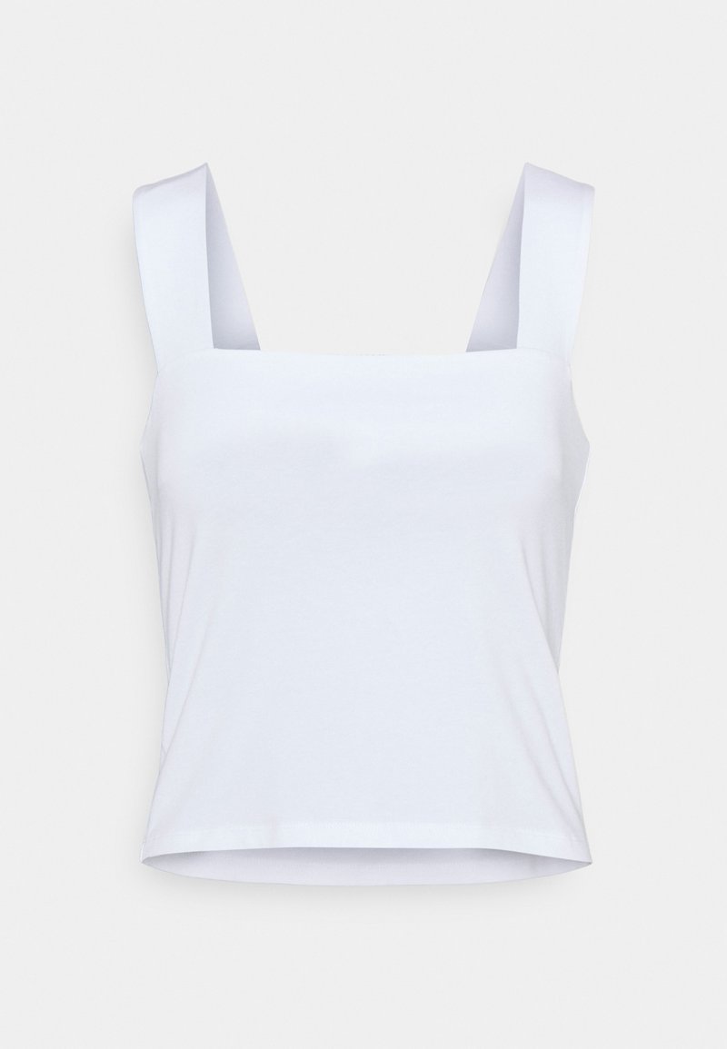 White cotton crop top featuring wide shoulder straps and a square neckline. Soft texture with a simple, unembellished design.
