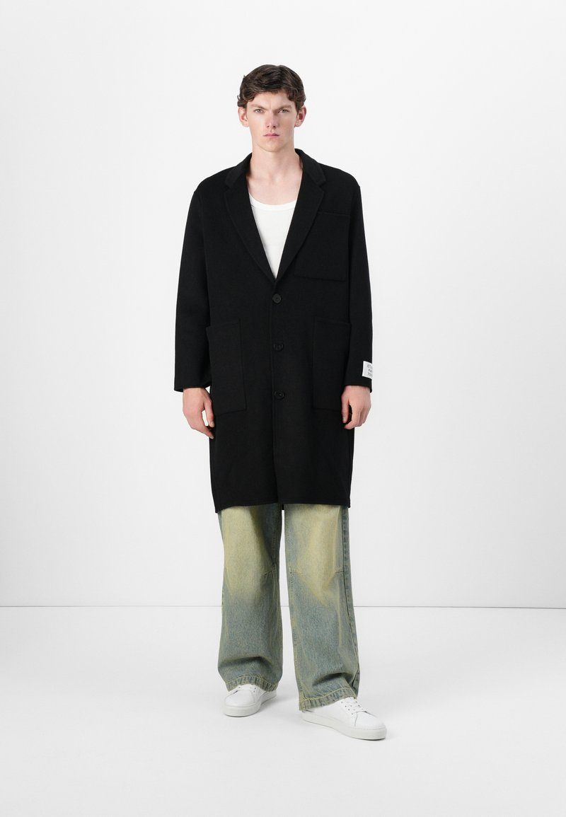 Études Mantel zwart