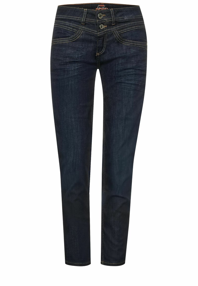 Jean slim bleu foncé avec double fermeture boutons, poches avant et coutures contrastantes, présenté sur fond blanc.