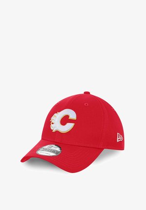 Red baseball cap made of fabric, featuring an embroidered white and gold "C" logo with flames on the front, and a structured crown.