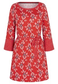 Punainen mekko, jossa on kolmivartiset hihat, kukka- ja lehtikuvio, vyötäröllä vyö ja hihansuissa pilkkukuvioita. Puuvillainen materiaali.