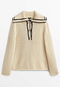 Pull en tricot crème à manches longues avec grand col et bordure noire, doté de trois boutons sur la patte de boutonnage devant.