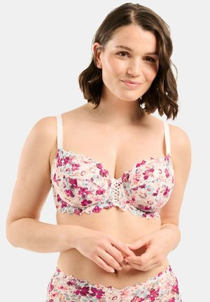 Reggiseno in pizzo floreale color crema con accenti rosa e blu. Presenta coppe morbide, spalline regolabili e un bordo decorativo in pizzo.