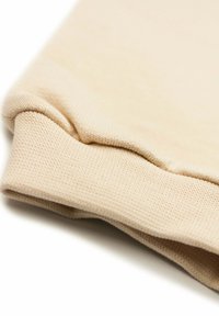 Beige katoenen sweatshirt manchet met ribbelstructuur, met een gevouwen zoom en een glad oppervlak. Aangepast voor comfort en pasvorm.