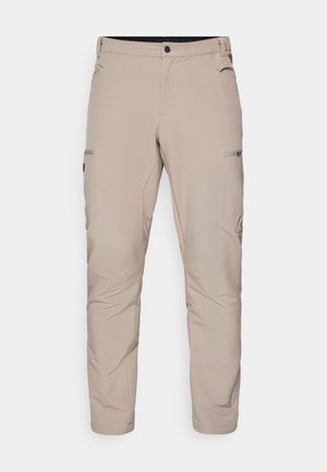 Pantaloni da esterno beige realizzati in tessuto leggero, dotati di due tasche laterali e una tasca cargo con zip, con una vestibilità su misura e una texture morbida.