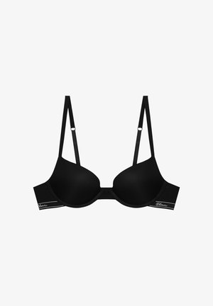 Black padded bra with ribbed texture, adjustable straps, and a smooth finish. Features logo accent in white on the band.