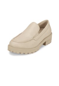 Beige slip-on shoe with a textured surface, rounded toe, and thick rugged sole. Minimalist design with side stitching details.
