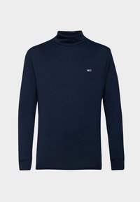 Navyfarbener Rollkragenpullover mit langen Ärmeln aus glattem Stoff, der ein kleines Logo auf der Brust und schmal geschnittene Bündchen aufweist. Einfaches und minimalistisches Design.