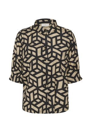 Chemisier col montant en tissu beige avec un motif de cubes géométriques noirs, manches courtes avec des poignets retroussés et fermetures à boutons sur le devant.