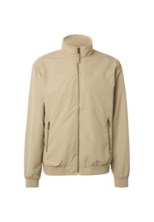 Béžová bunda na zip s vysokým límcem, elastickými manžetami a dvěma předními kapsami na zip, zobrazena na bílém pozadí.