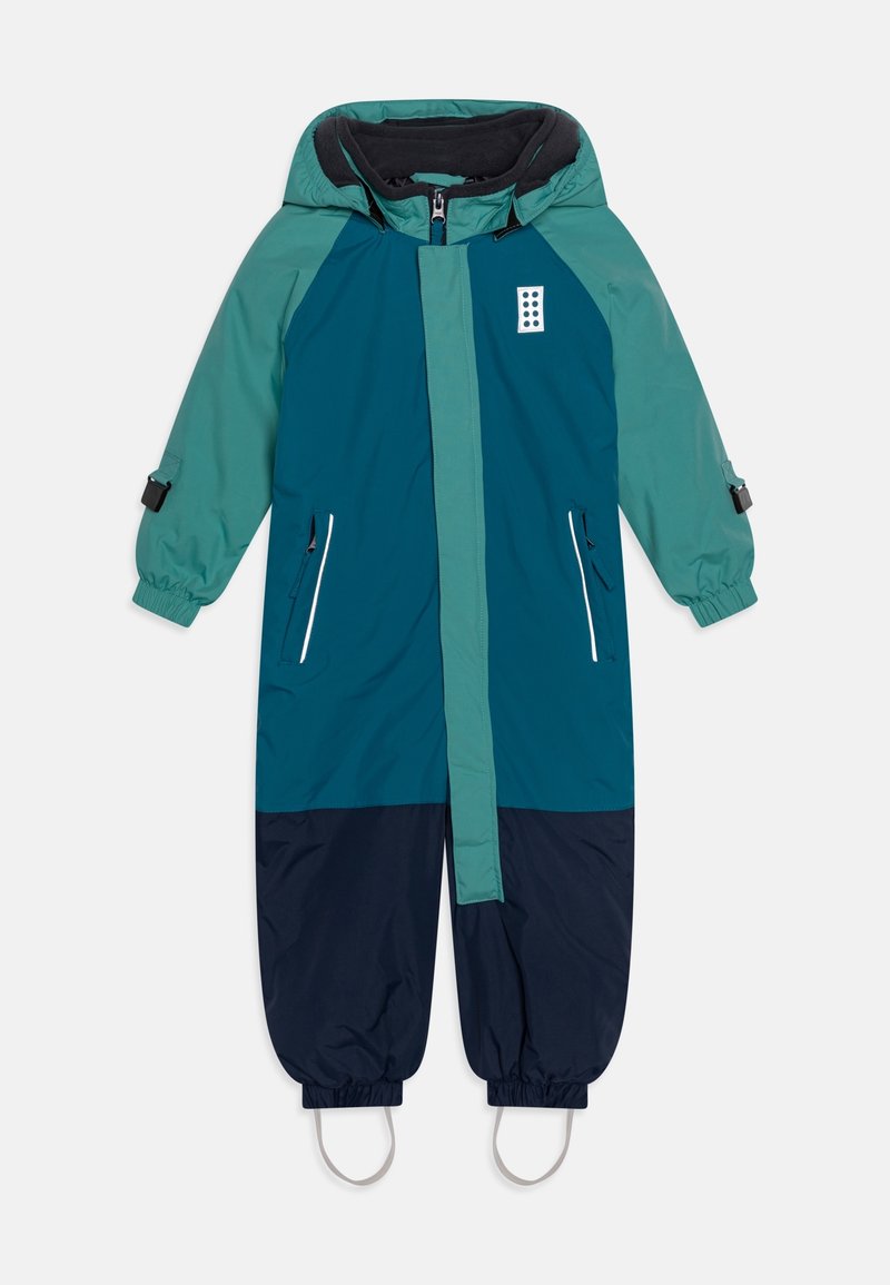 Dětský snowsuit v odstínech tyrkysové a navy modré, s kapucí, elastickými manžetami a kapsami na zip. Vyrobeno z voděodolného materiálu s hladkou texturou.
