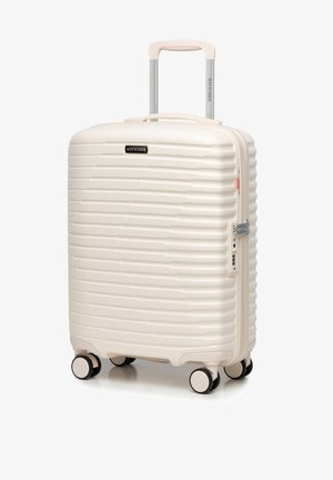 Wittchen Hardshell-Koffer in Creme mit gerillter Struktur, silbernem Griff und vier schwarzen Rädern. Ausgestattet mit Reißverschluss und Zahlenschloss.