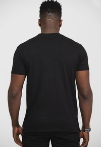Paradiso Clothing NIRVANA IN UTERO ANGELIC  - Print T-shirt - black