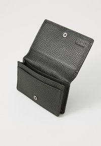 Black textured leather wallet with a snap closure, featuring multiple compartments and a branded logo on the interior.