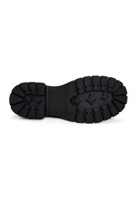 Black rubber boot sole with deep, defined tread patterns and star-like details. Smooth surface with curved edges for stability.