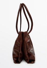 Brown leather handbag with two rounded, stitched handles and a soft, gathered design. Smooth texture with a subtle sheen.