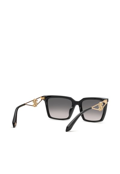 Lunettes de soleil carrées noires avec des verres à dégradé foncé et des accents décoratifs dorés sur les branches.