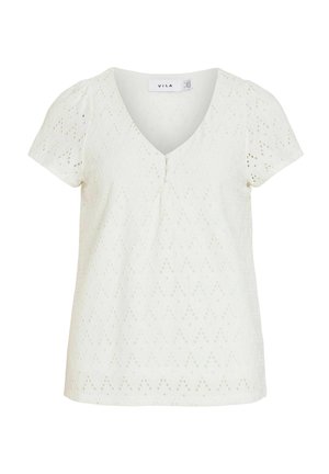 Blusa blanca de manga corta con cuello en V, pequeños botones forrados de tela y patrón de ojales en zigzag por toda la prenda.