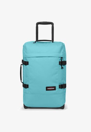 Borsa da viaggio turchese con ruote, cinghie nere, manico retrattile e toppa con logo, caratterizzata da una texture liscia e forma rettangolare.