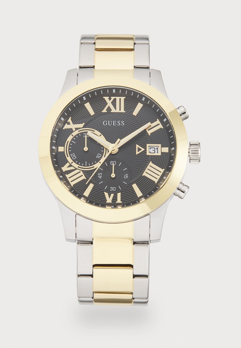 Orologio in acciaio inossidabile argento e oro con quadrante nero texturizzato, numeri romani, display della data e due sottodial.