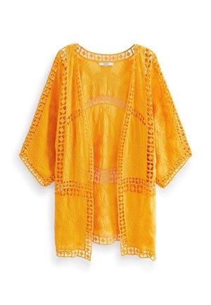 Cárdigan de encaje de color naranja brillante con abertura frontal, bordado floral y detalles geométricos recortados en las mangas, el frente y el bajo.