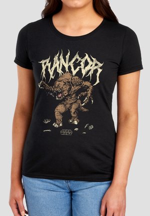 Woman wearing black t-shirt with graphic of a Rancor monster and stylized text above, with Star Wars logo below.
