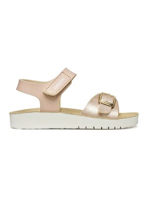 Sandale beige et or rose métallisé avec bride de cheville en velcro, boucle dorée sur la bride à l'avant, et semelle coussinée blanche.