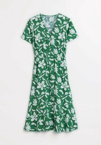 Grön klänning med V-ringning och korta ärmar. Har ett blommönster i vitt, en elastisk midja och en utsvängd kjol.